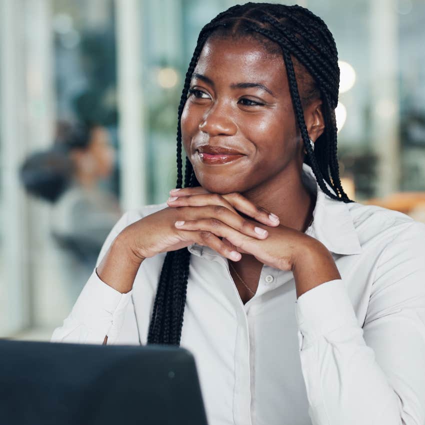 happy woman at work whose actions speak to her character