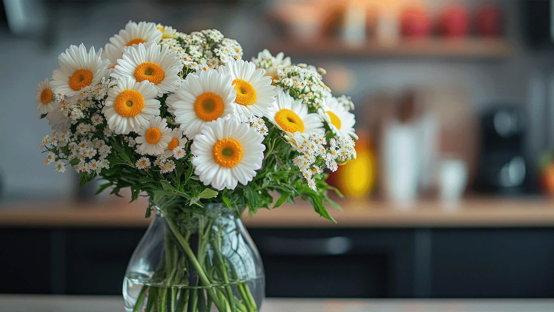 fresh flowers in a fully-stocked kitchen