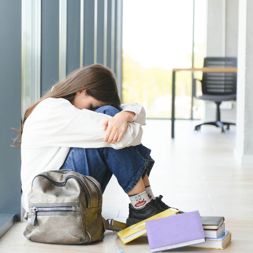 teen girl being bullied in high school