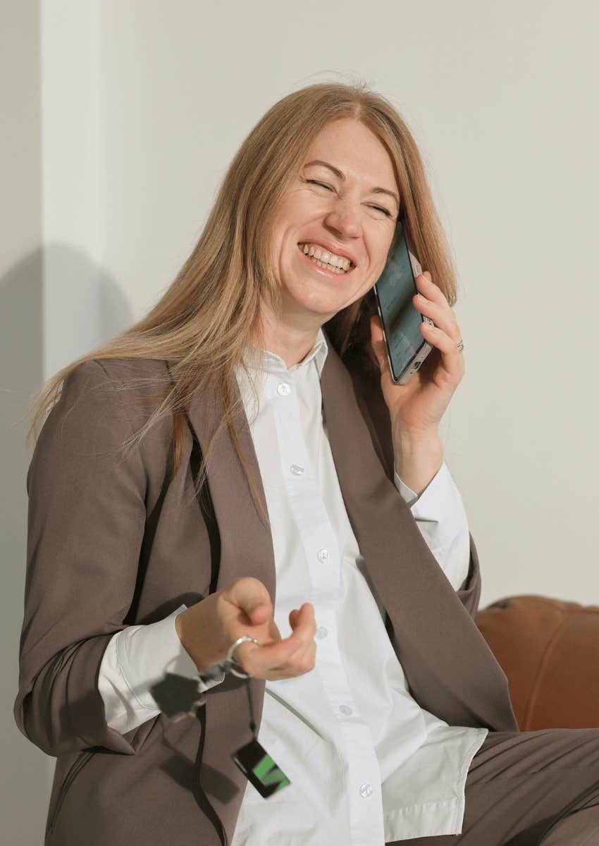 mature woman smiling while talking on phone