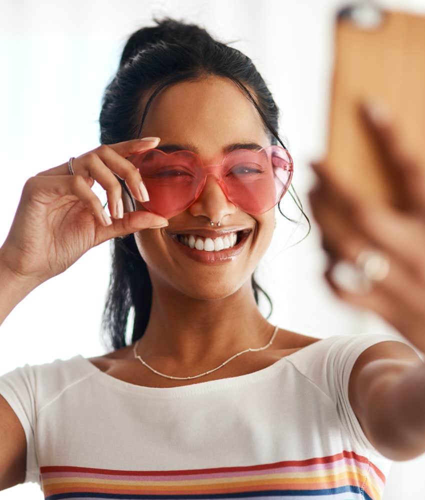 happy woman taking selfie