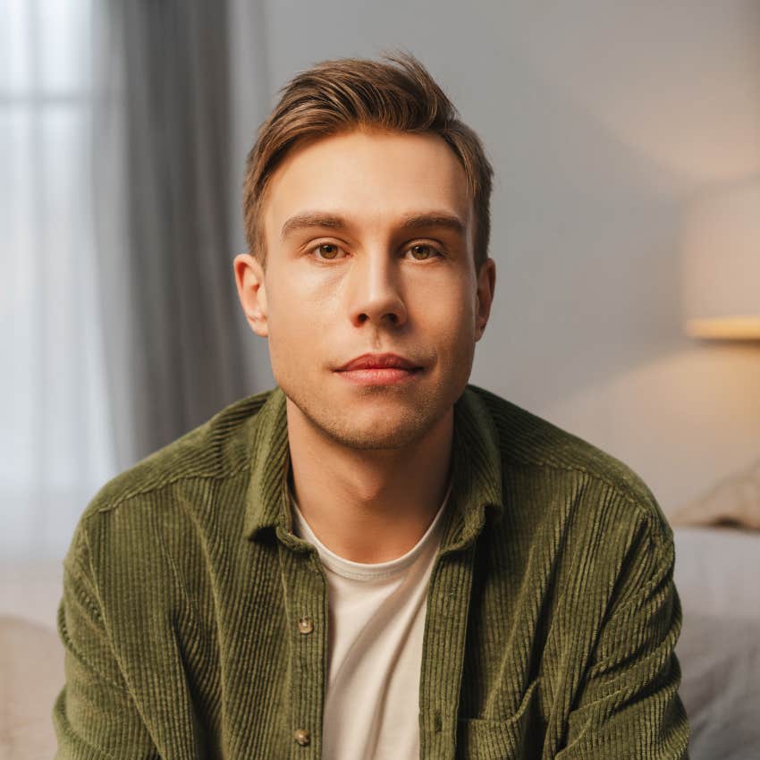 portrait of serious young man sitting 