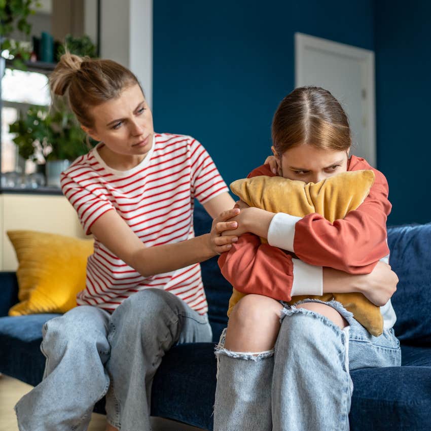 mom trying to talk to upset teen daughter