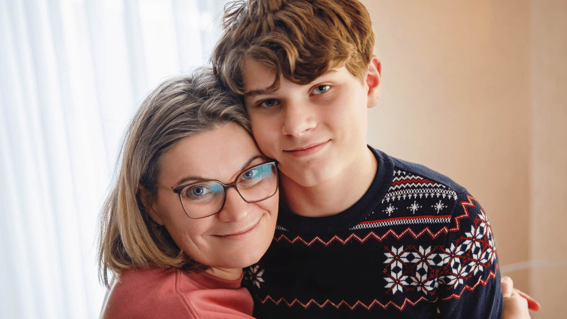 narcissistic mom hugging teenage son who's not allowed to refuse physical affection