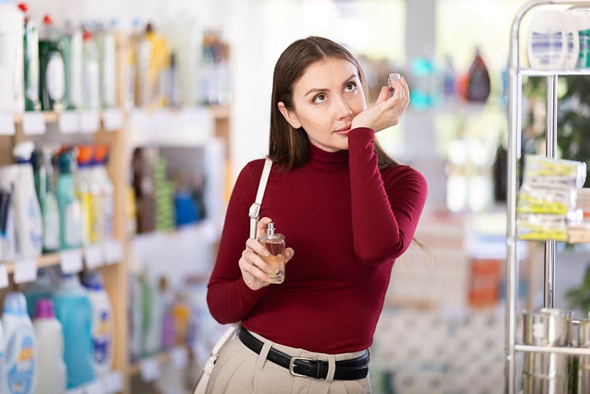 woman smells perfume that makes her feel nostalgic and calm