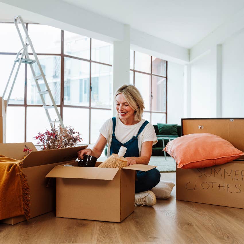 woman unpacking boxes after relocating