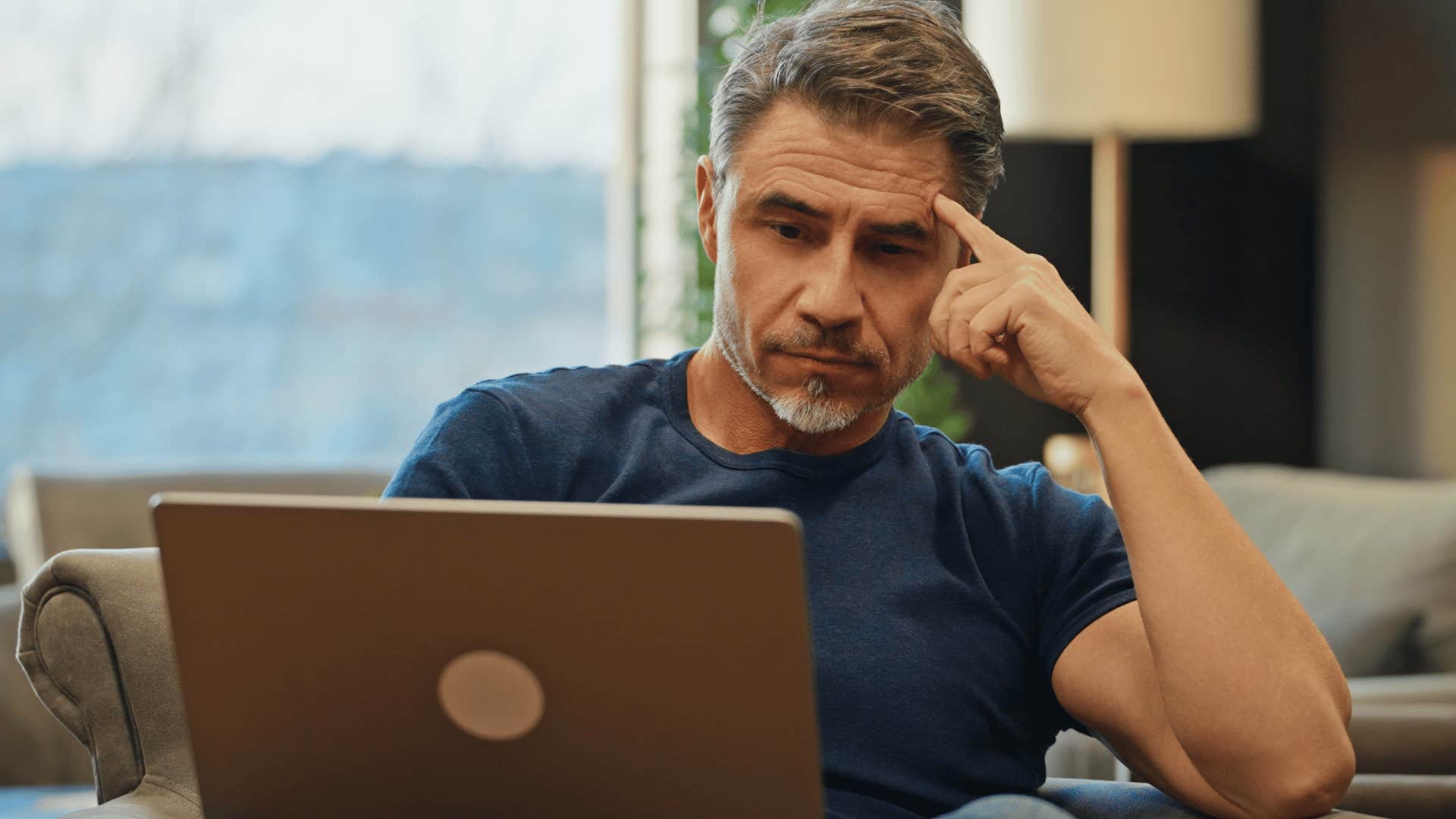 man who's started making decisions alone looking at computer