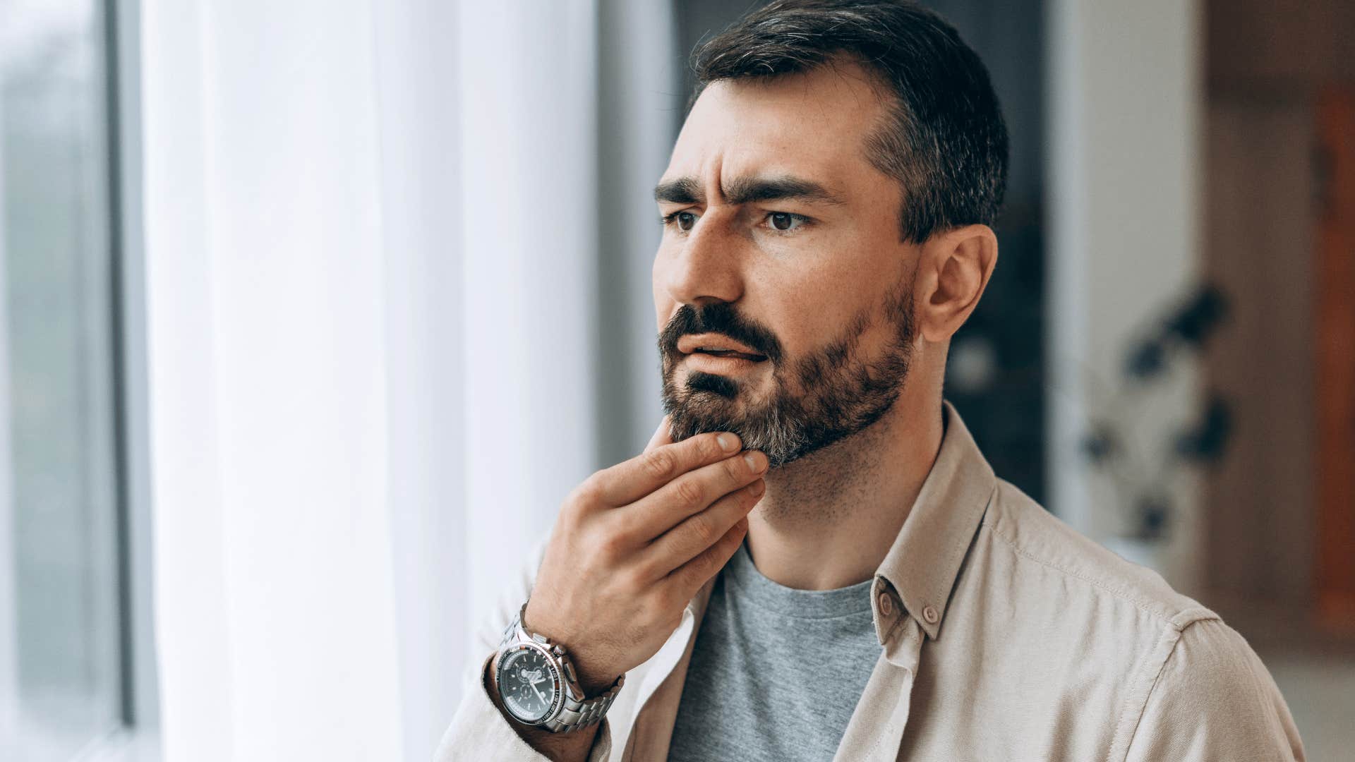 pensive man who's started spending more time alone 