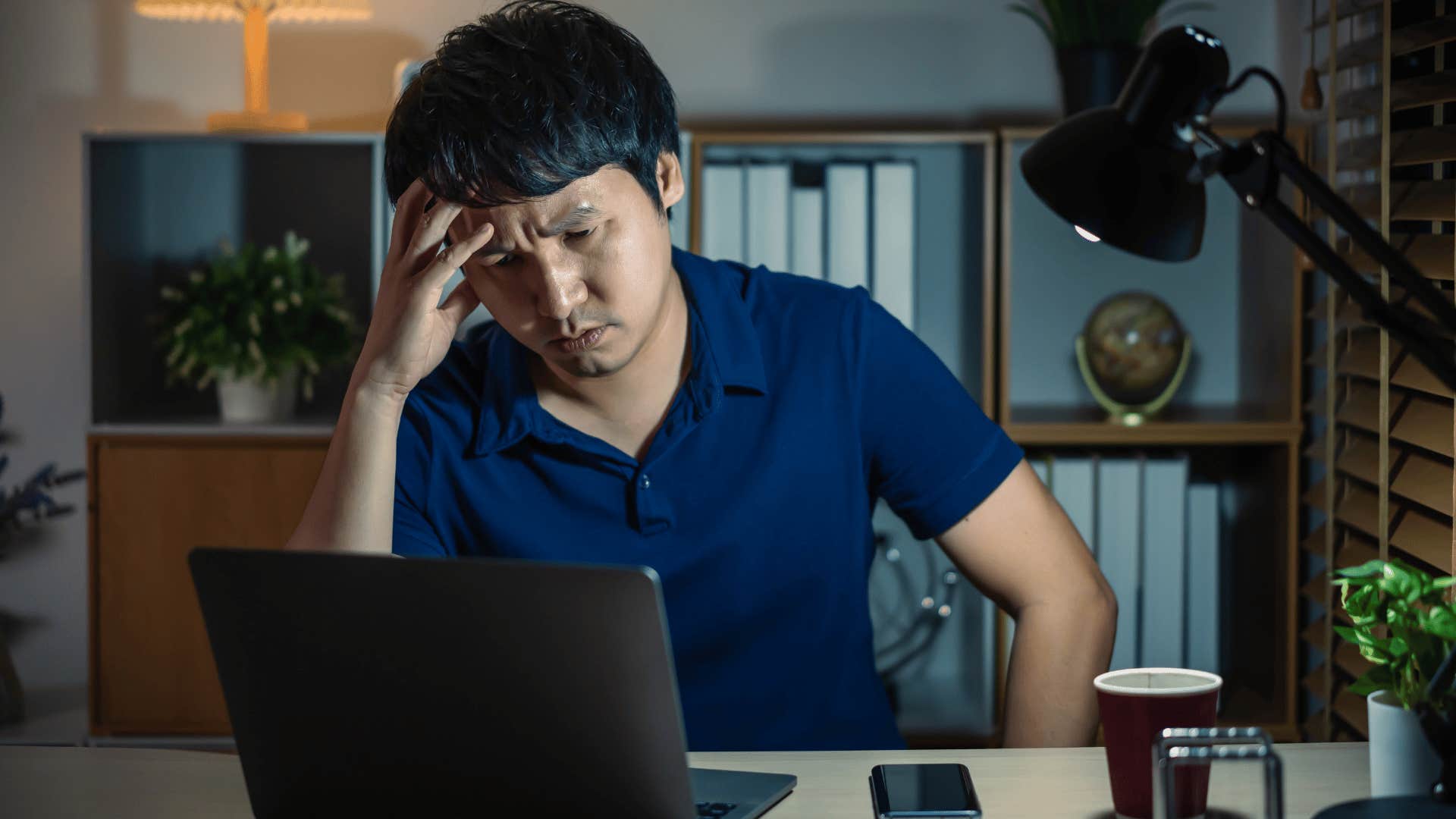 stressed man working late for no reason