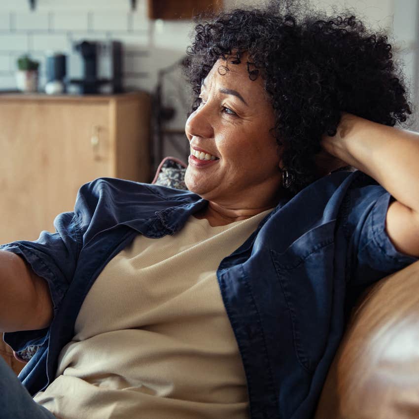woman in her 40s wearing comfortable clothes lounging at home