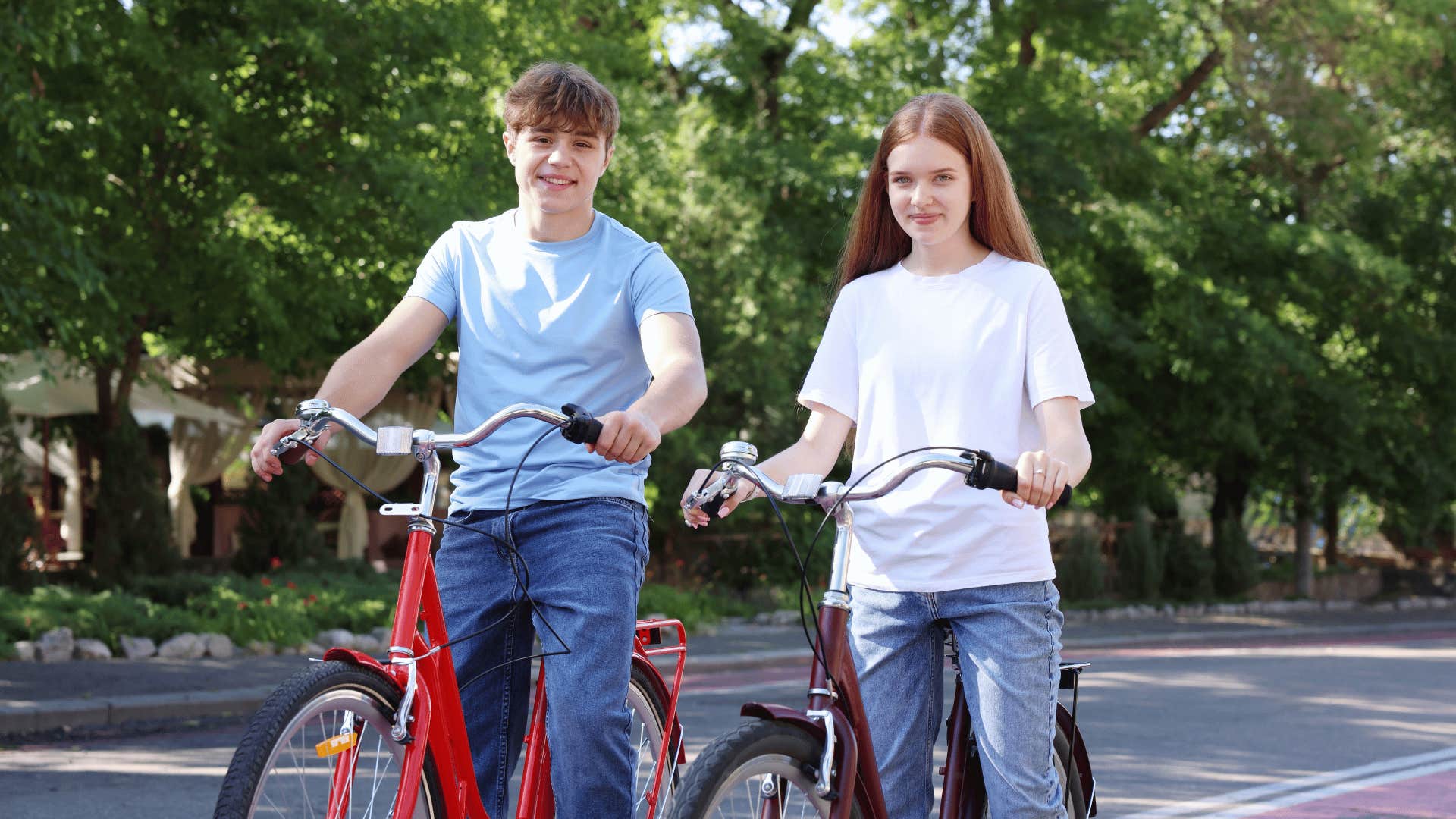 two teenagers riding bikes everywhere like kids did in the 60s and 70s