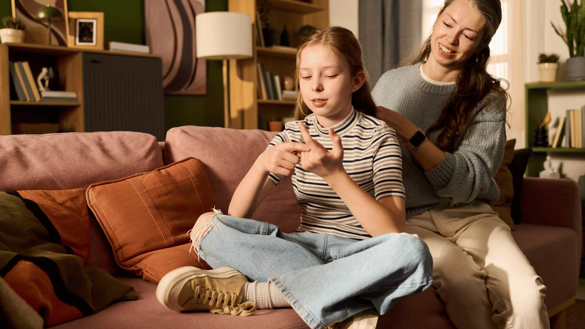 mom doing daughters hair while telling her to not worry about the rules