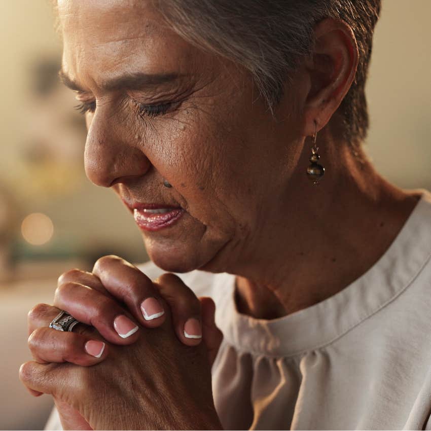 boomer woman committing to organized religion praying at home