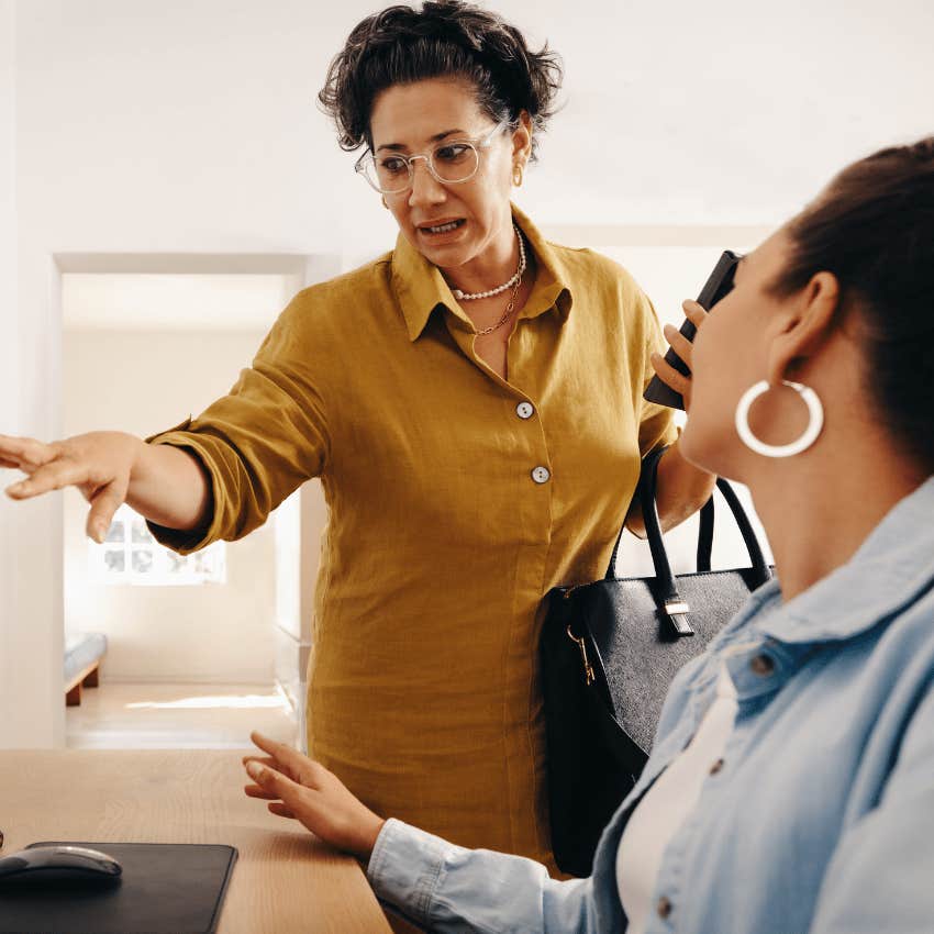 woman not giving instructions to colleague at work