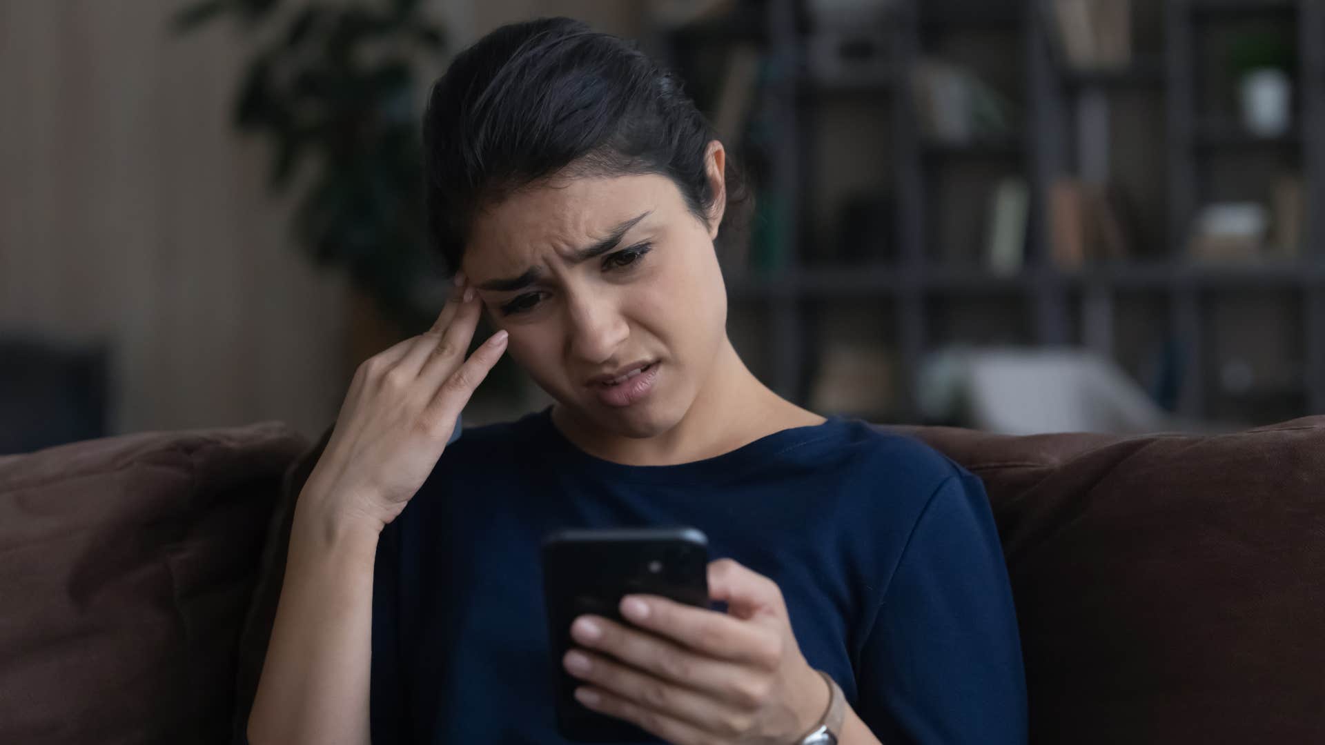 woman who hates phone calls because she worries about unexpected topics