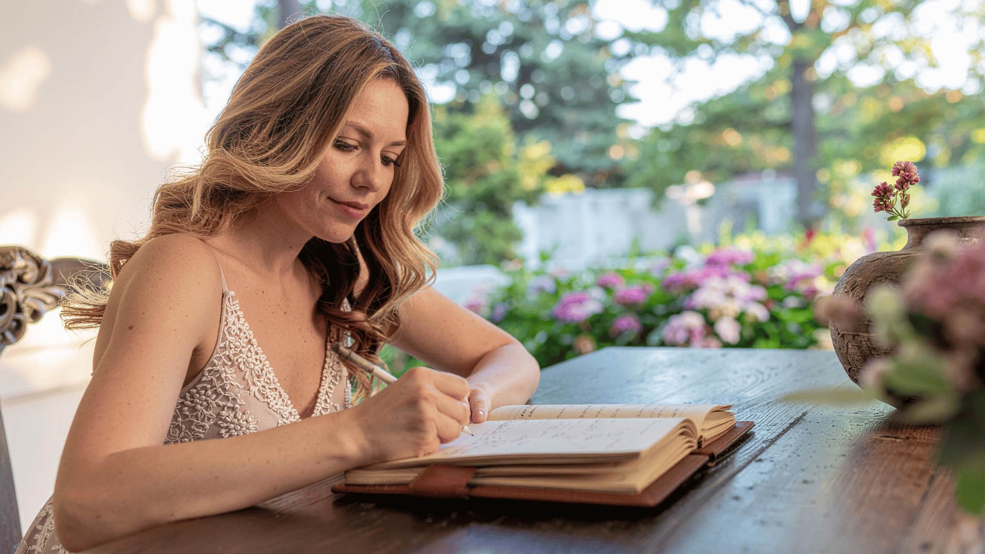 woman raised in the 70s and 80s writing in cursive