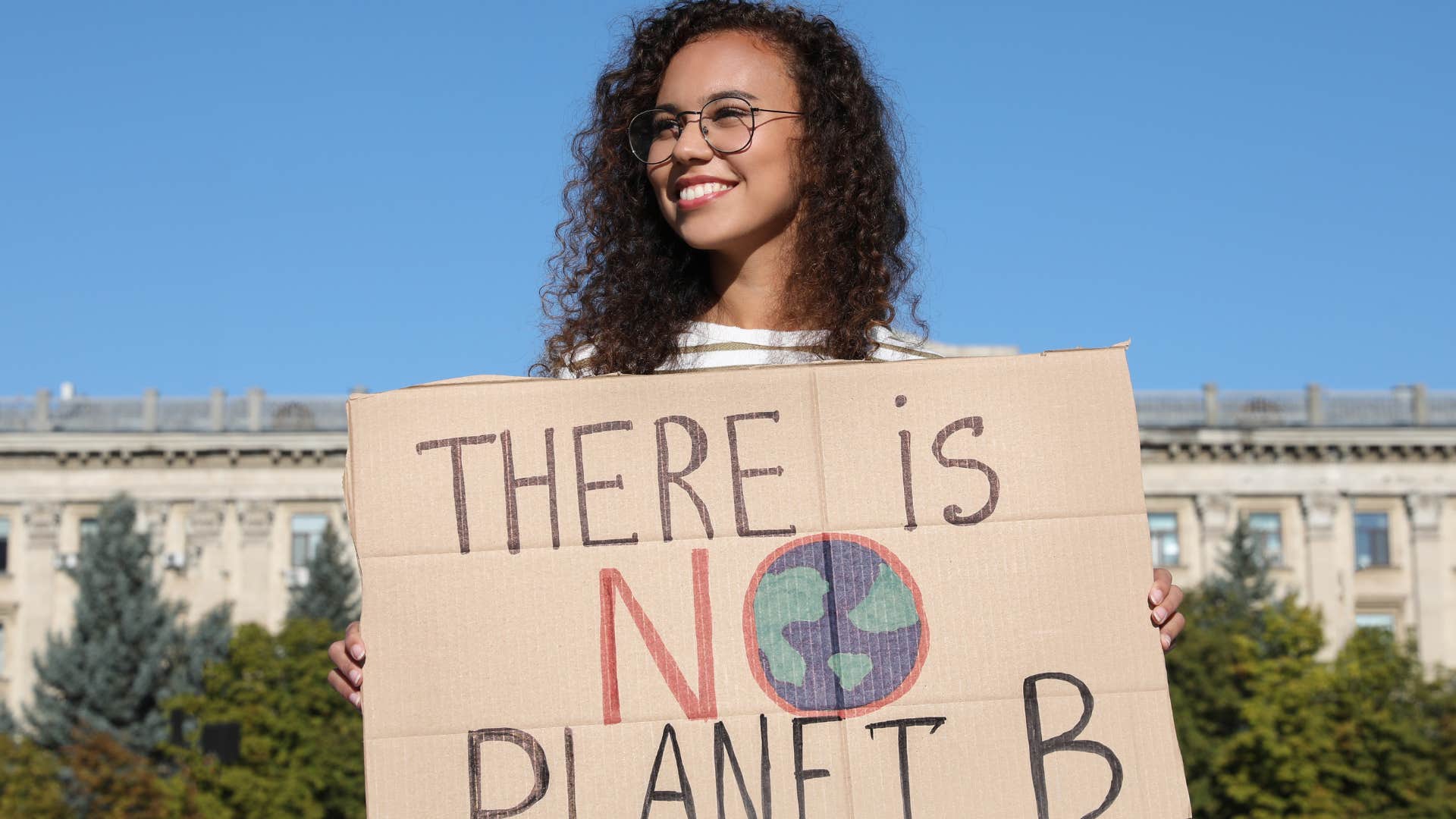 Woman worried about climate change advocating outside.