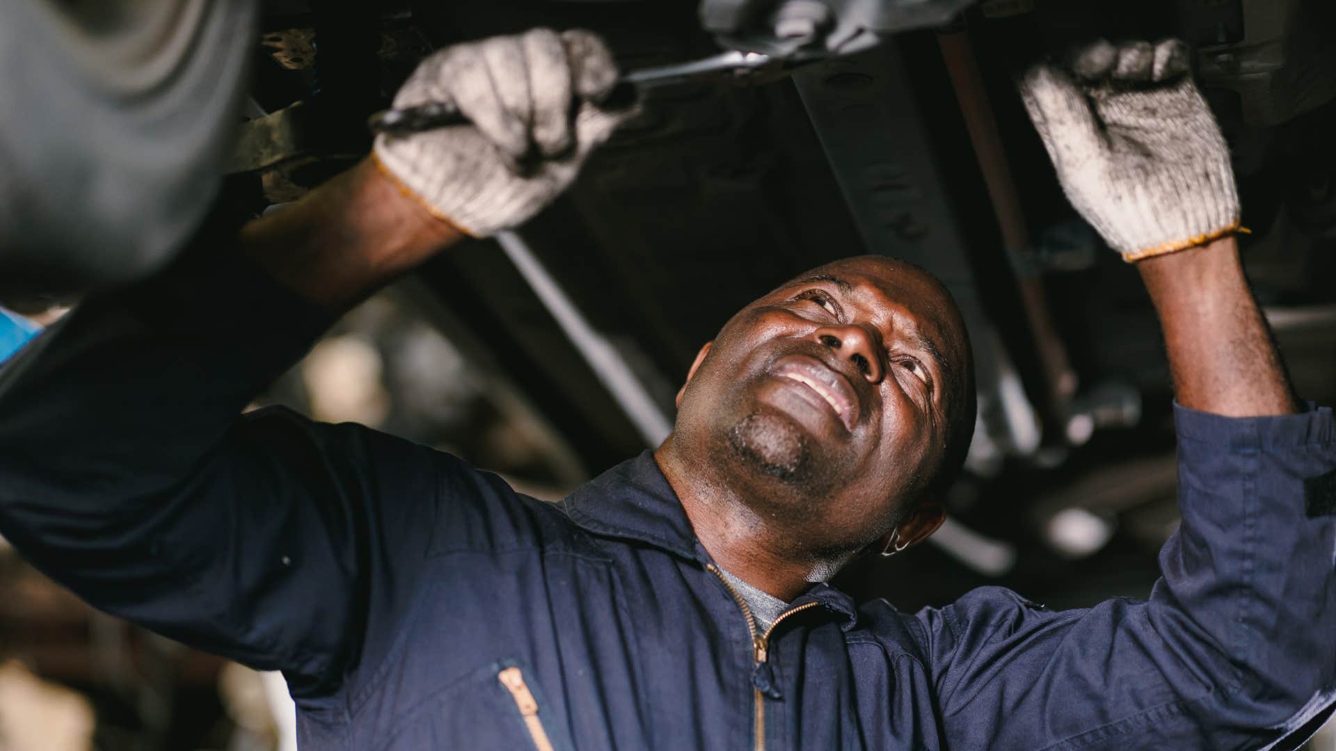 Gen X man doing basic car maintenance and repairs at home