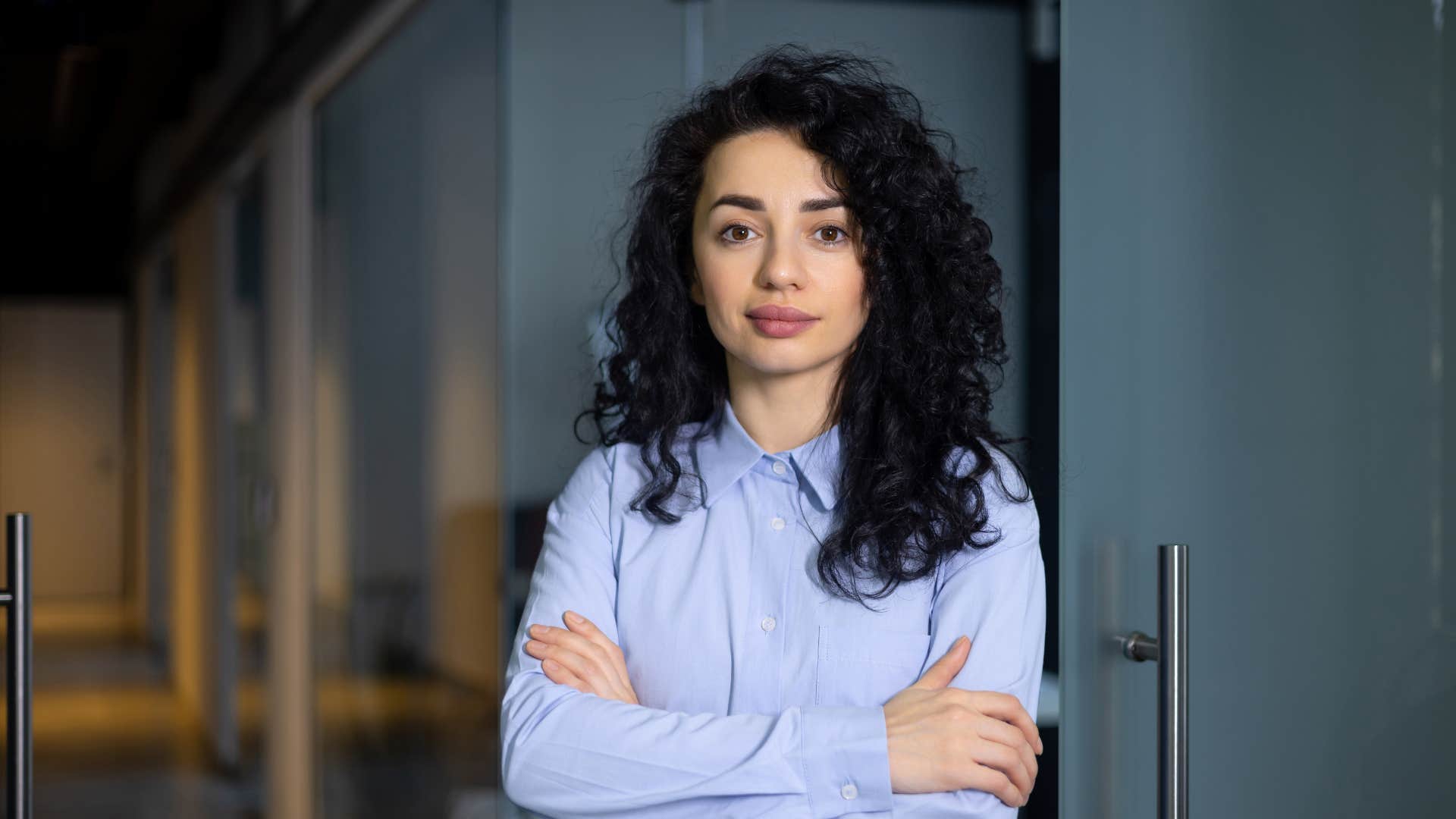 businesswoman standing with arms crossed