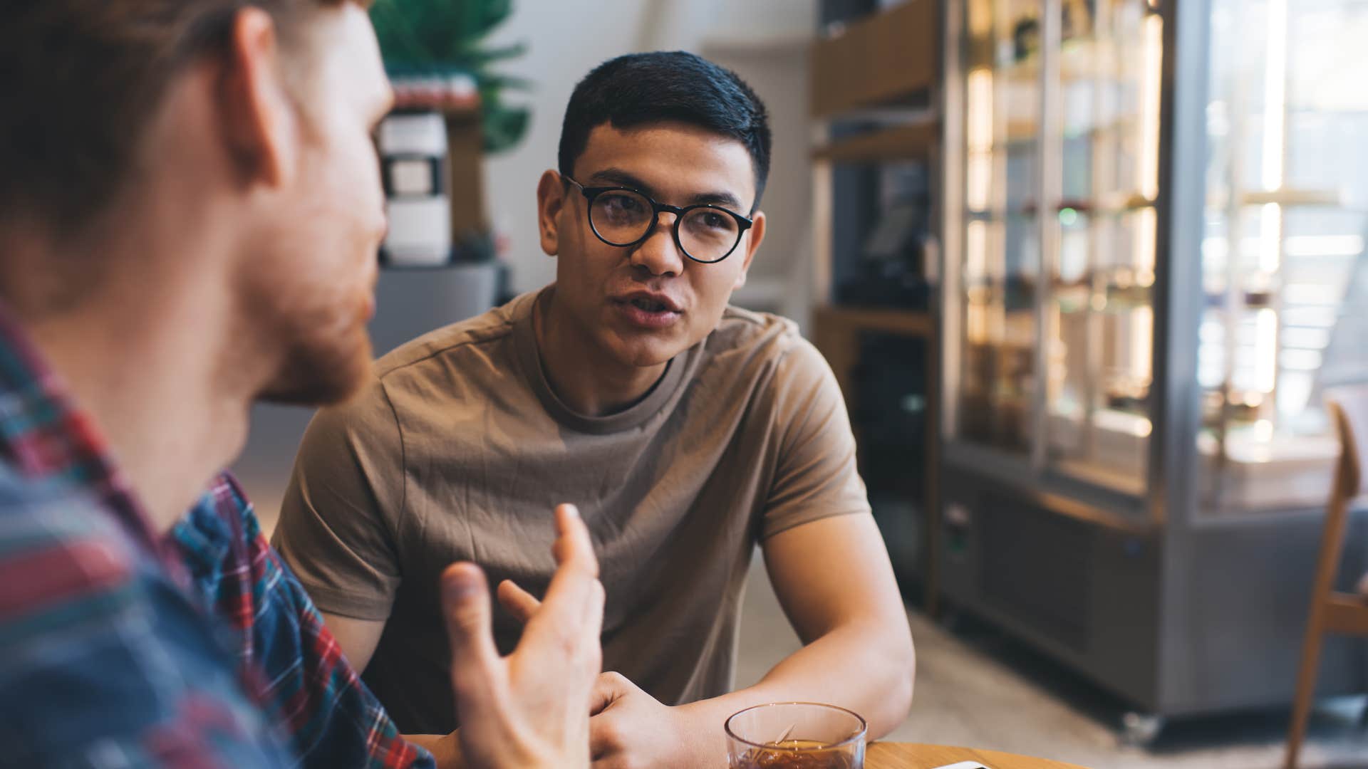 high-iq man in conversation with friend asking what assumptions are we making
