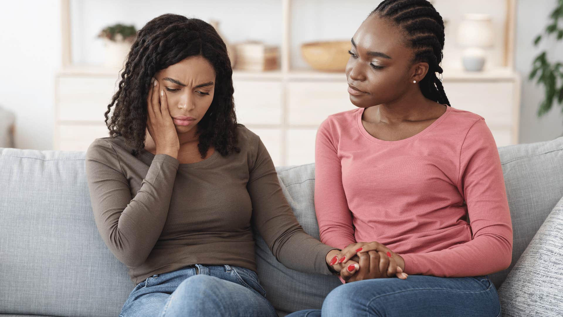 intelligent woman comforting her friend asking why are you feeling that way