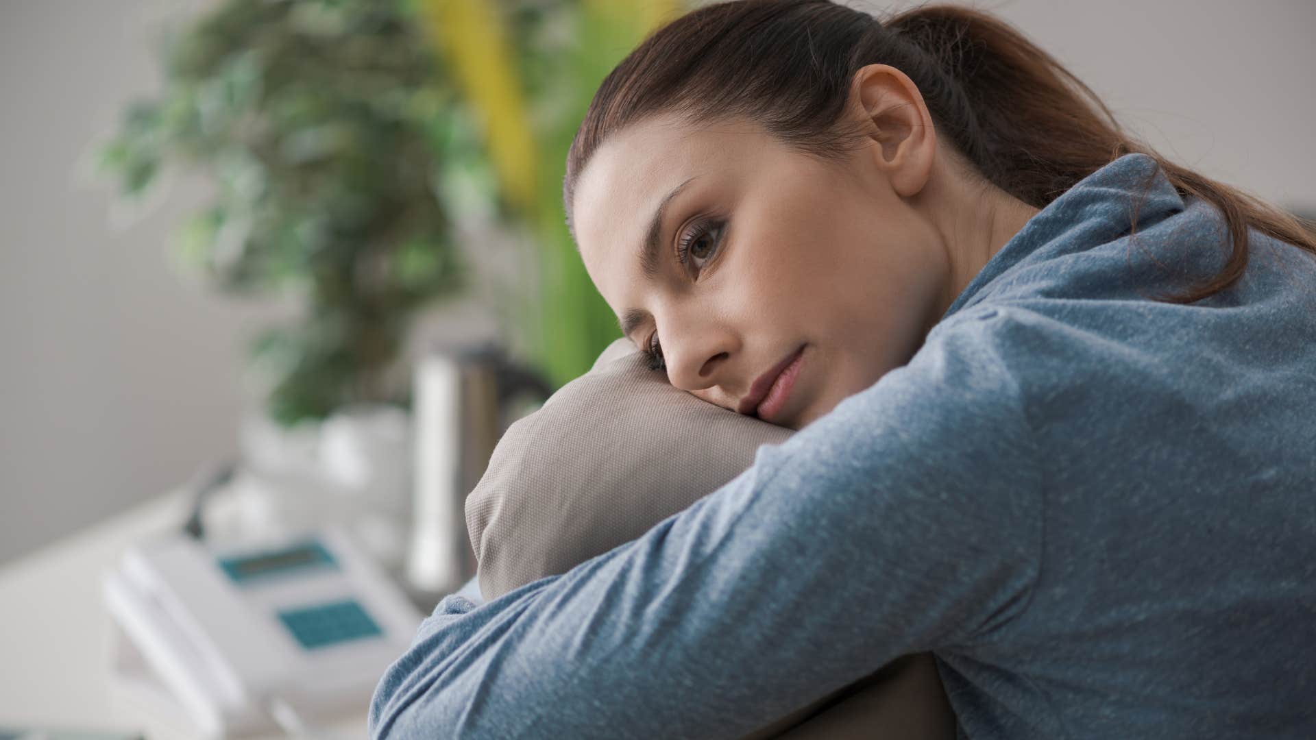 woman staying home canceling plans because her social battery is drained