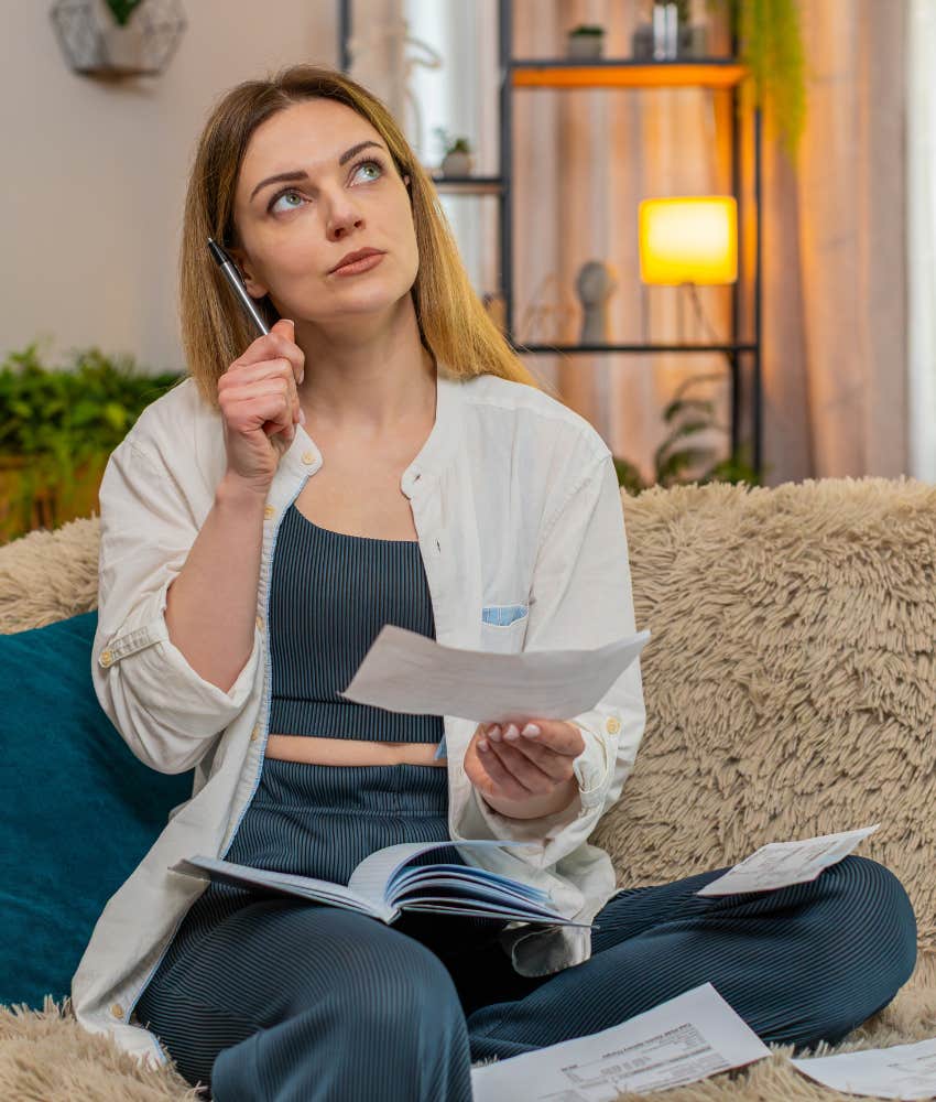 person with book and notecards showing reading habit