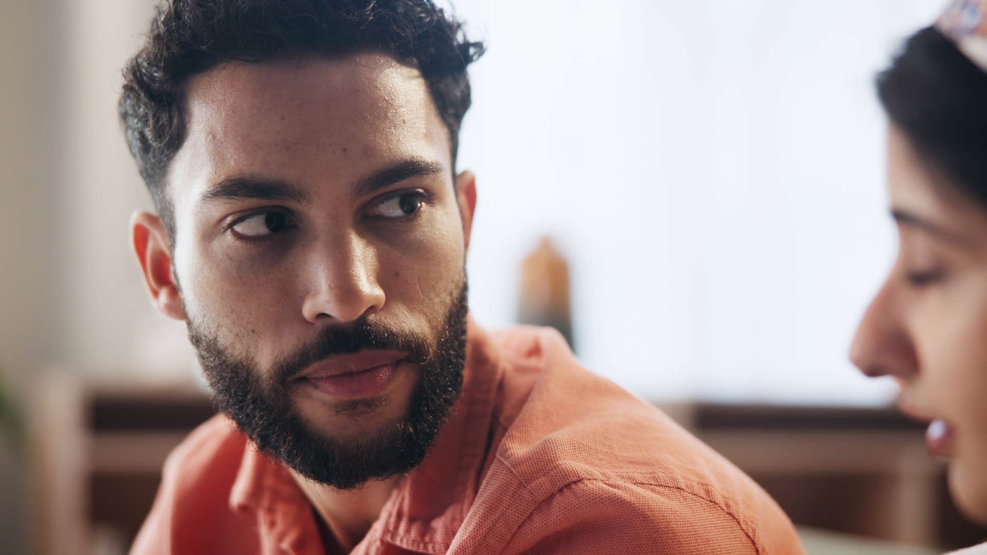 man noticing inconsistencies in wife's story