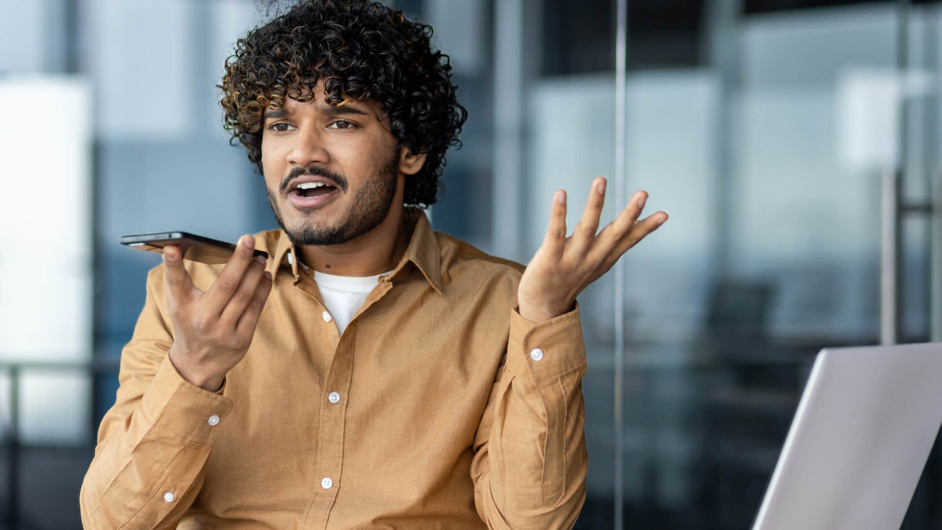 man using a higher-pitched voice while talking on the phone