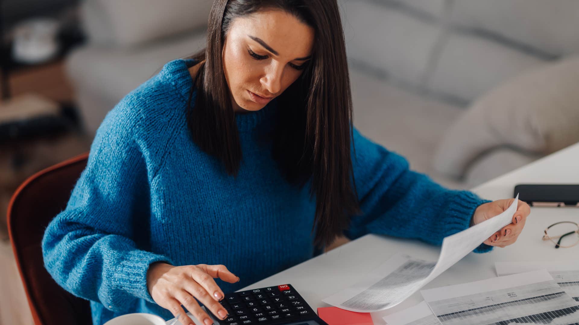 frugal woman working on her budget