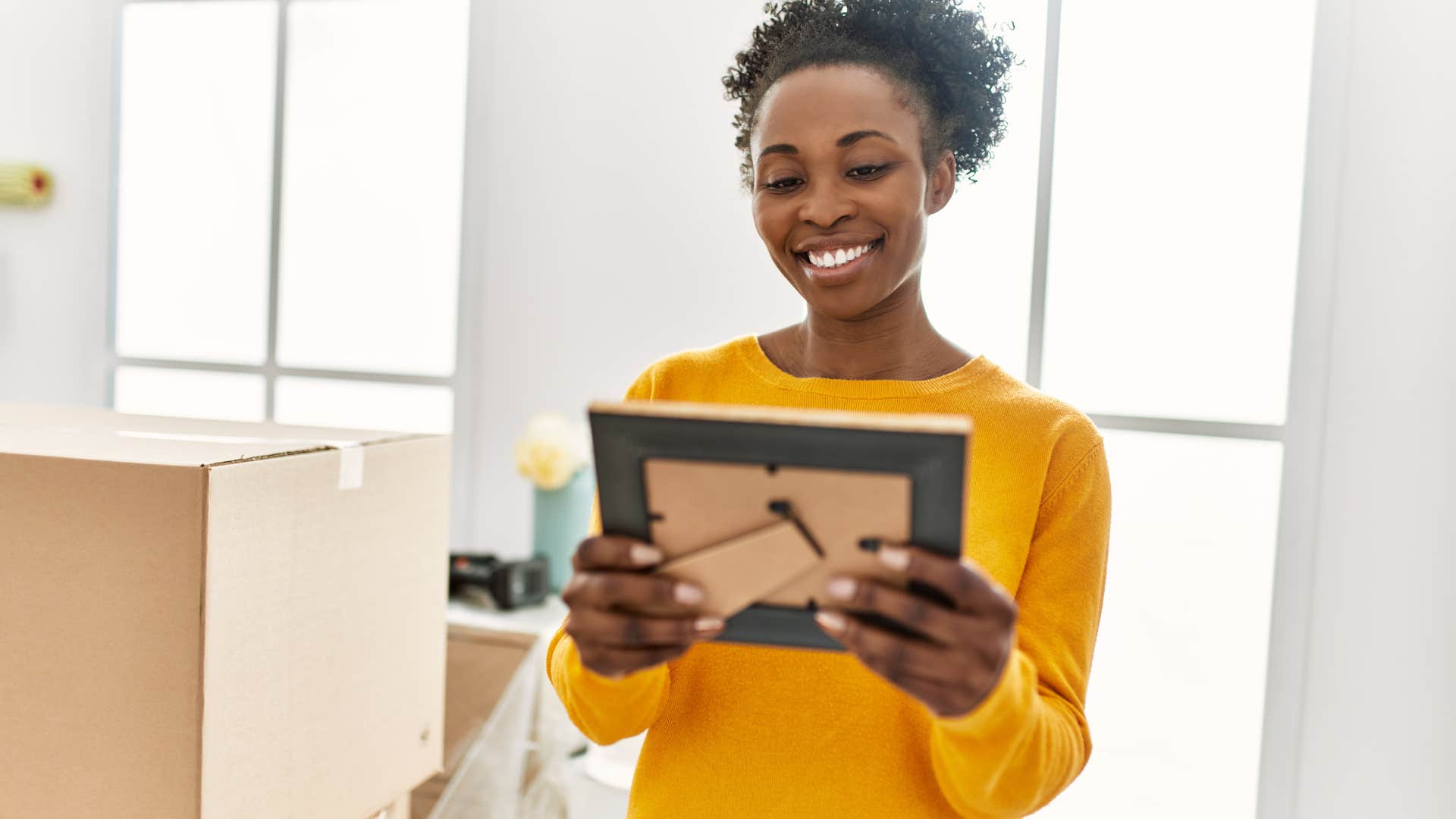 woman feeling sentimental while looking at pictures