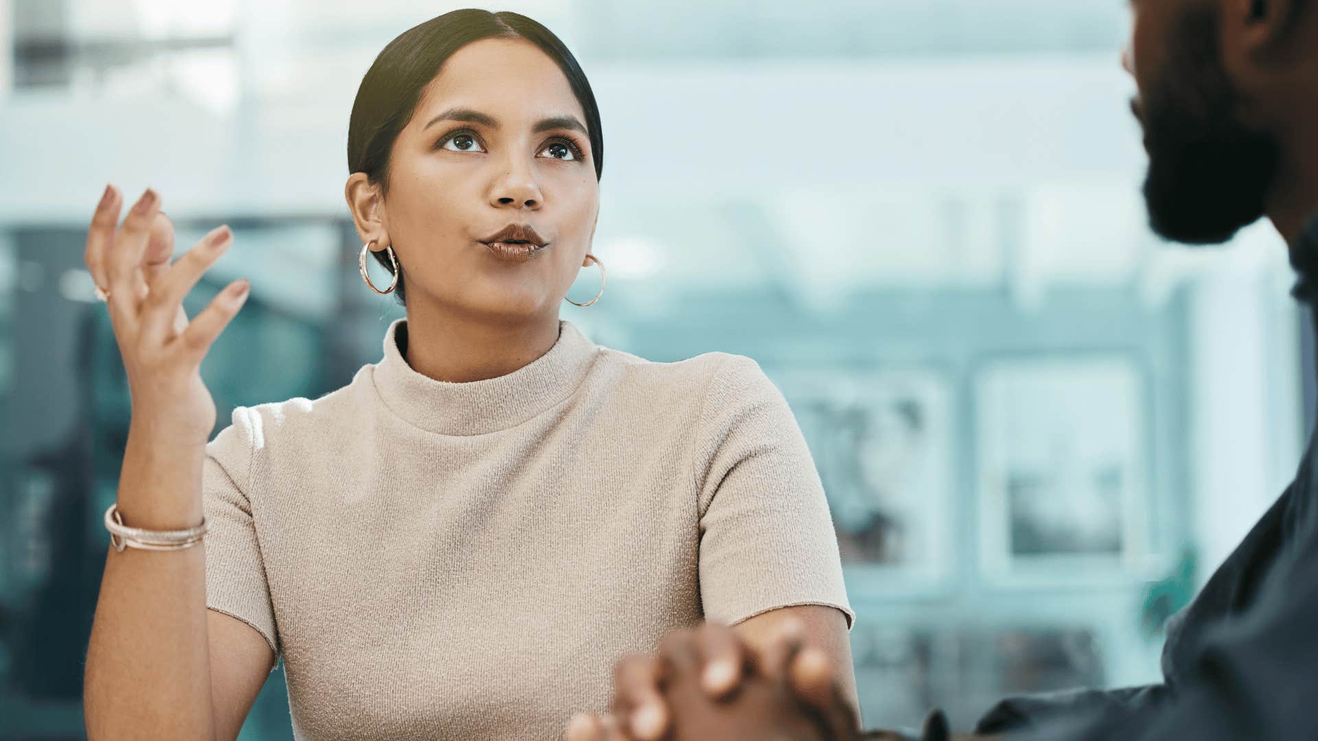 awkward woman talking to colleague saying i know this person in weird conversation