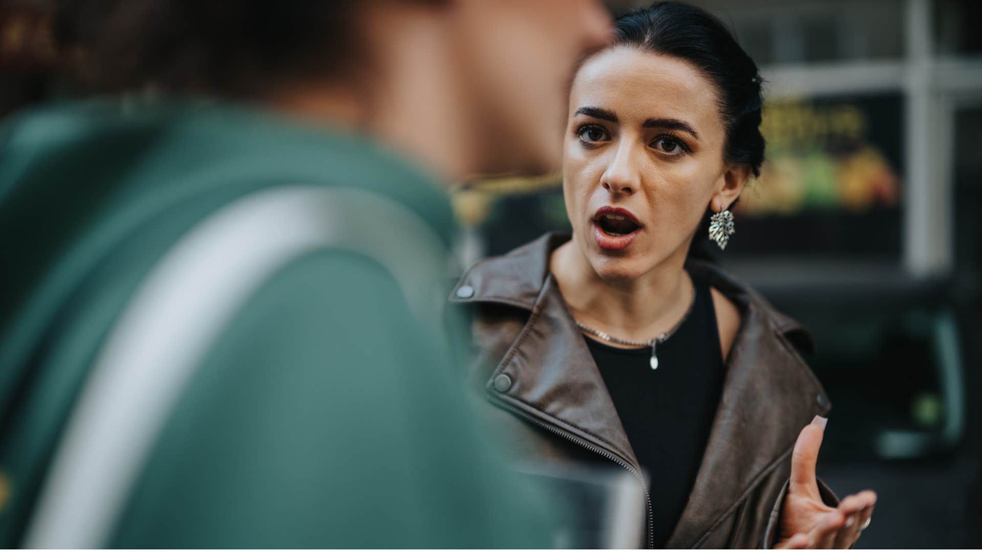 annoyed woman making conversation awkward by telling man let me just add