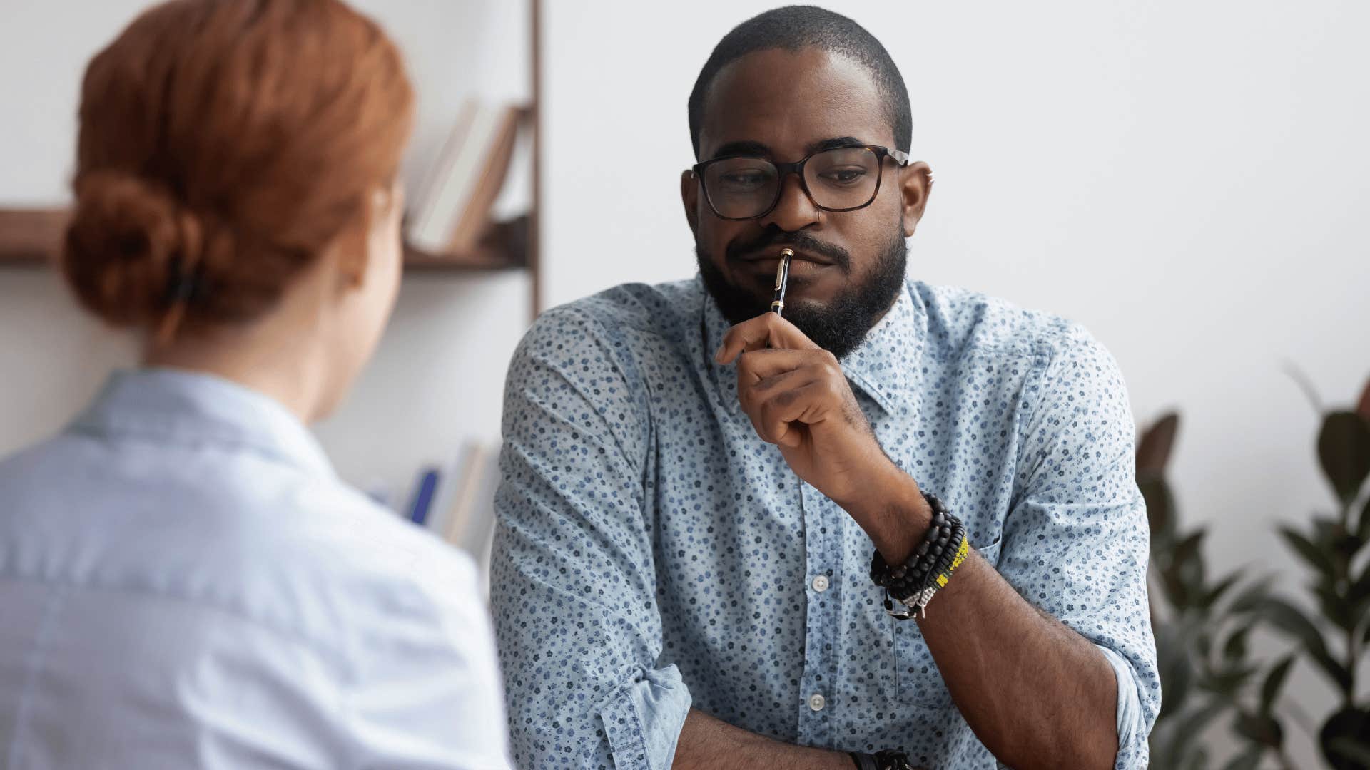 awkward man turning to colleague saying this is awkward
