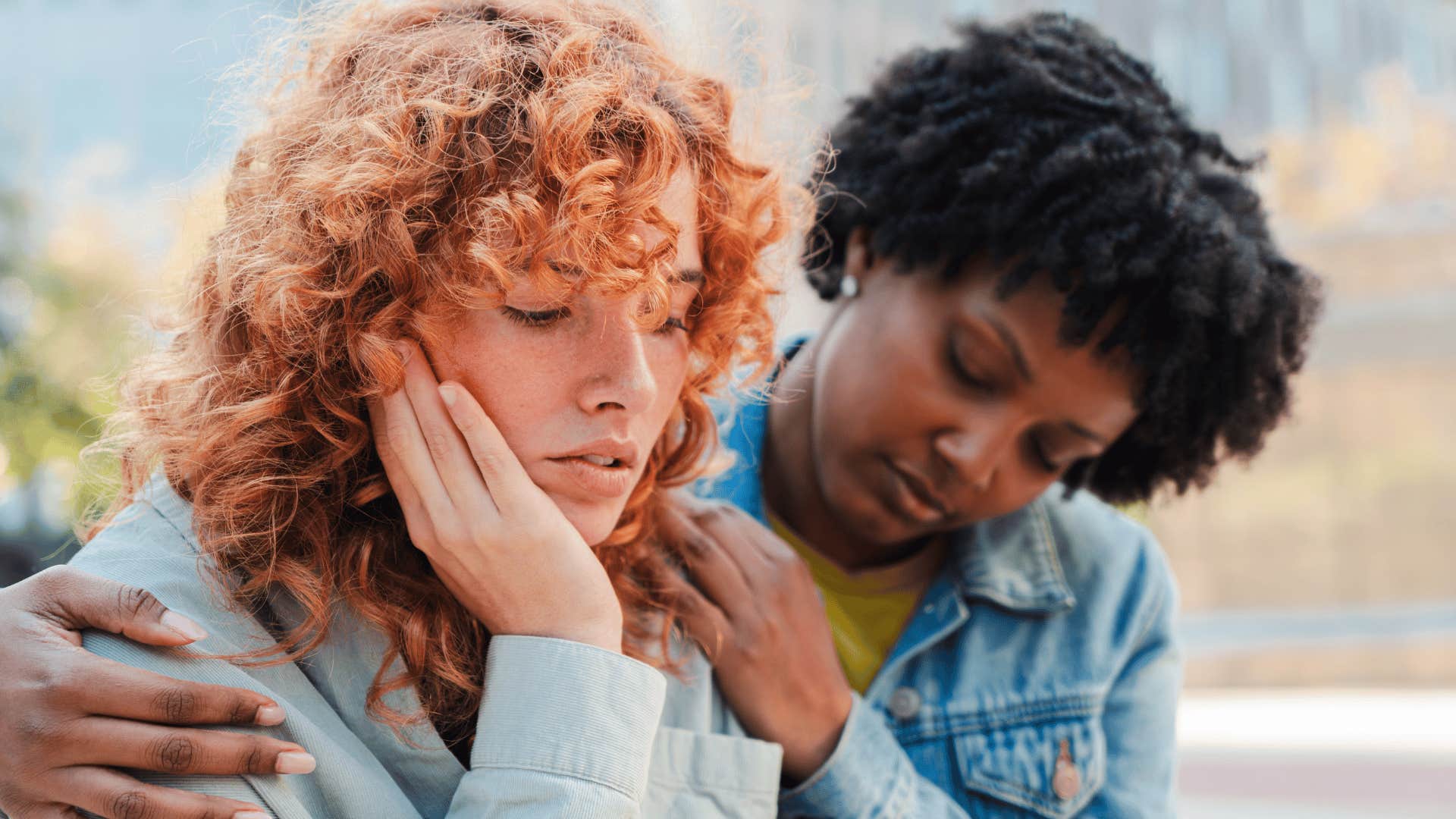 woman comforting awkward friend who is saying you must hate me