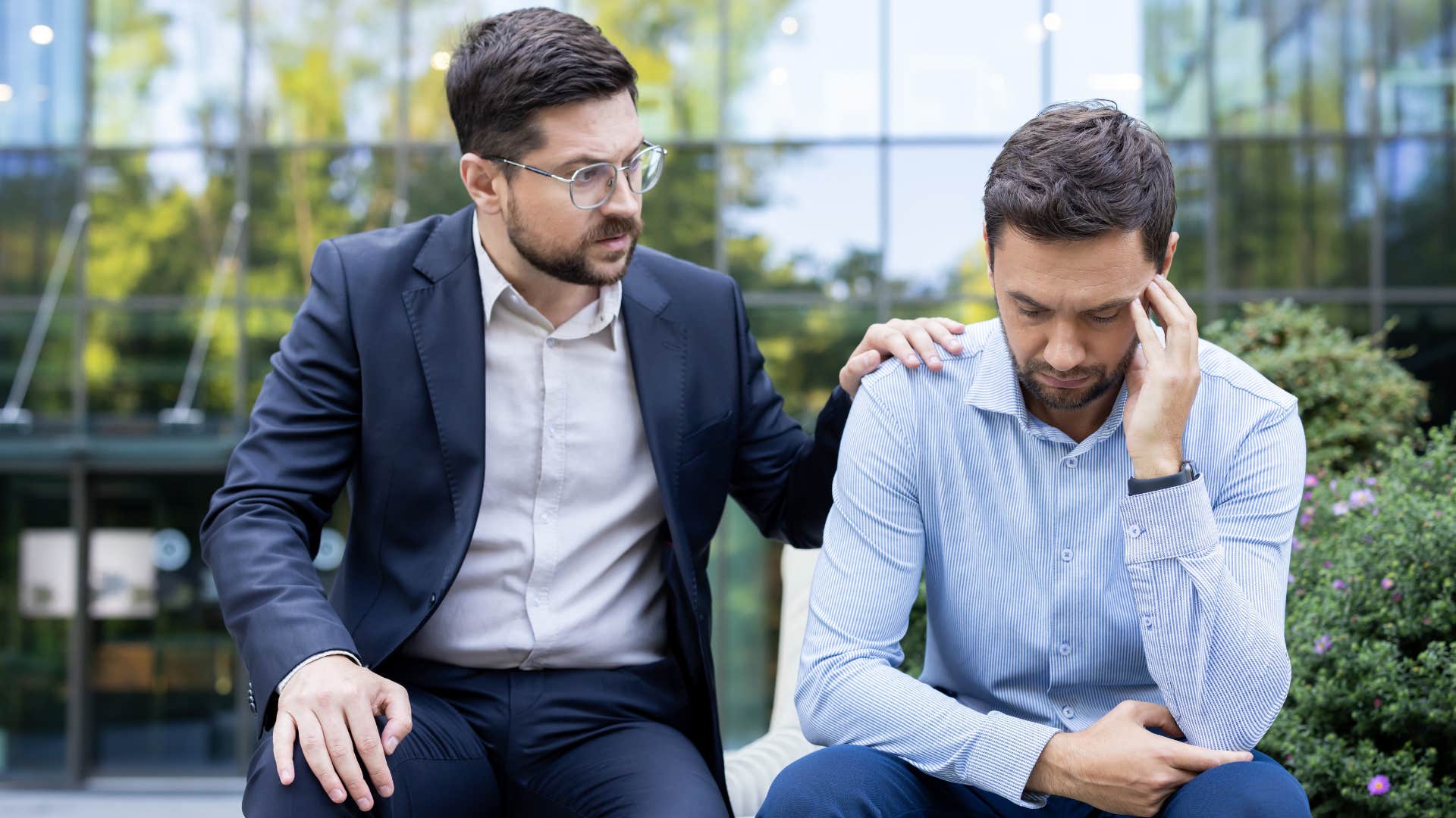 man comforting co-worker saying let me make this right