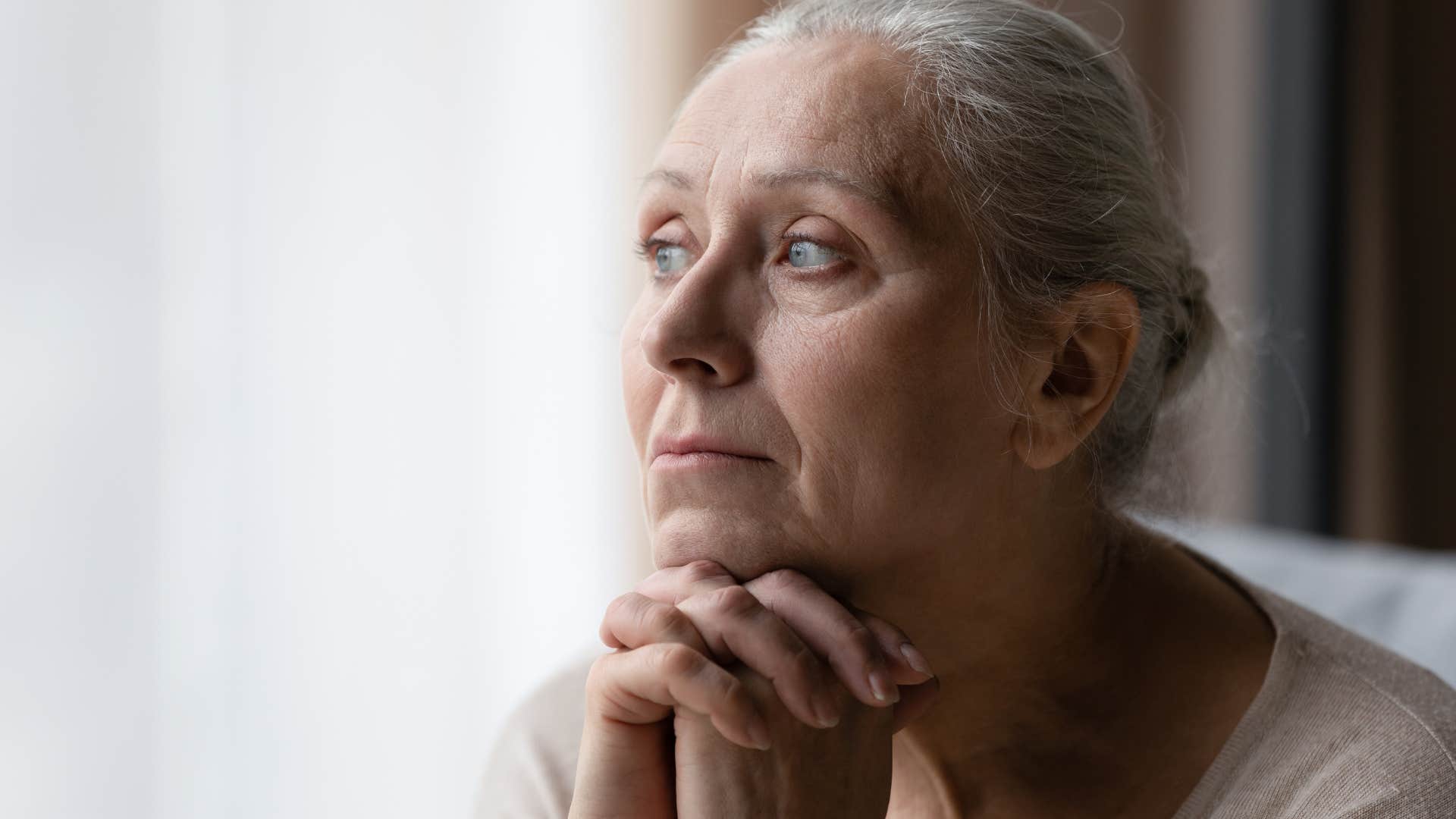 retired woman feeling bored at home