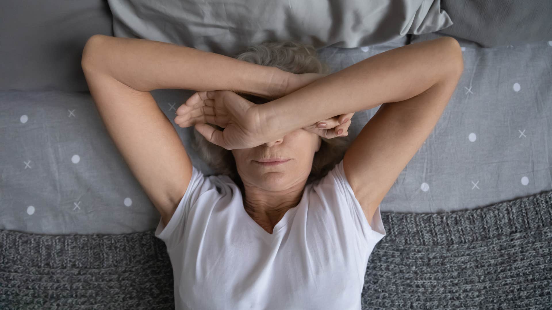 sad retired woman feeling like she doesn't have a reason to get out of bed in the morning