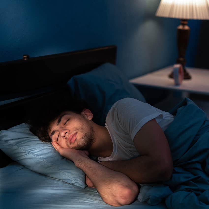 man sleeping in bed