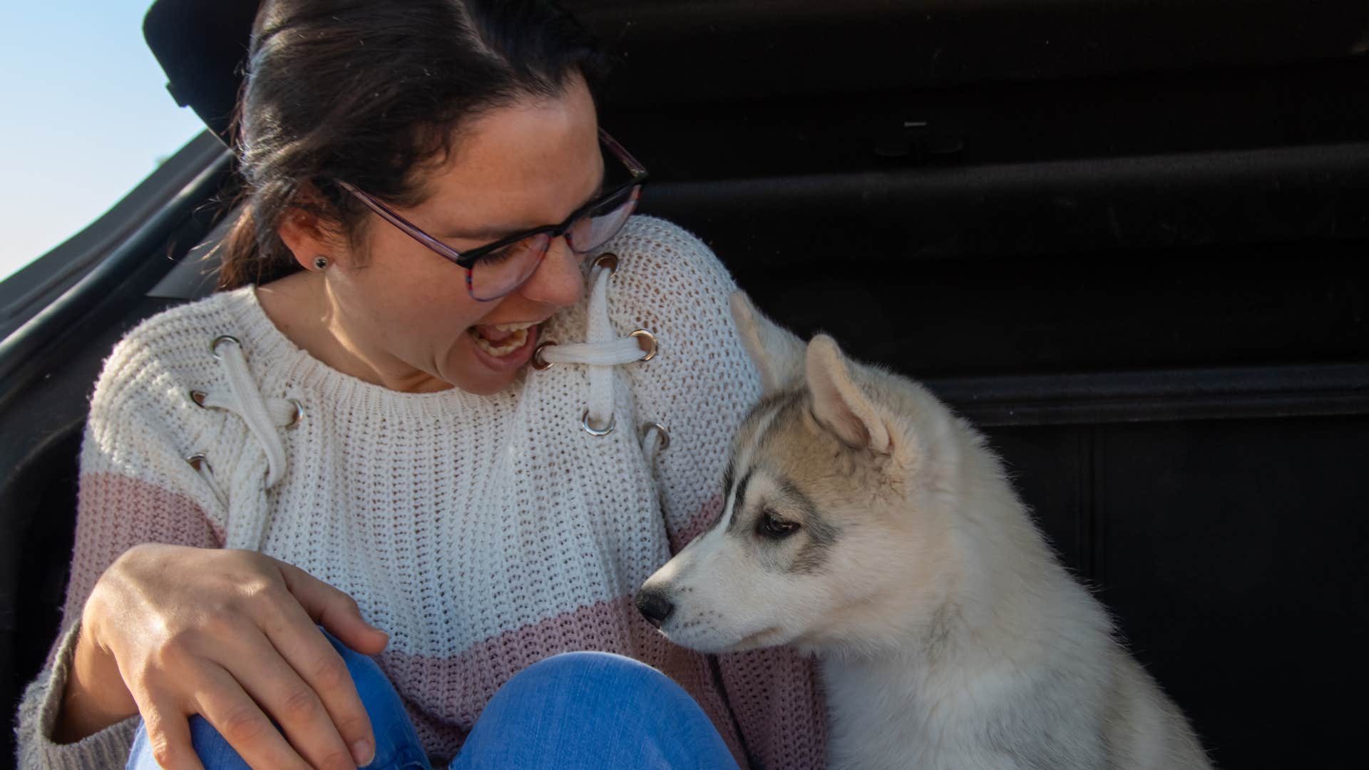 woman condemning her dog for being excited