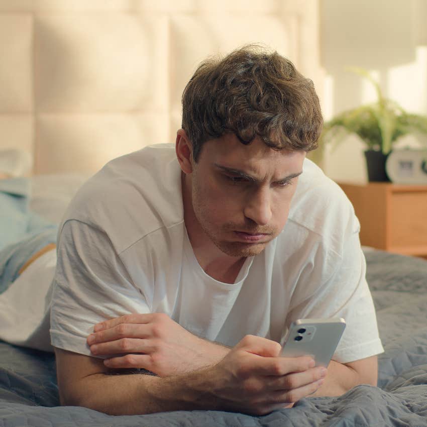 millennial man concerned about privacy while using smartphone