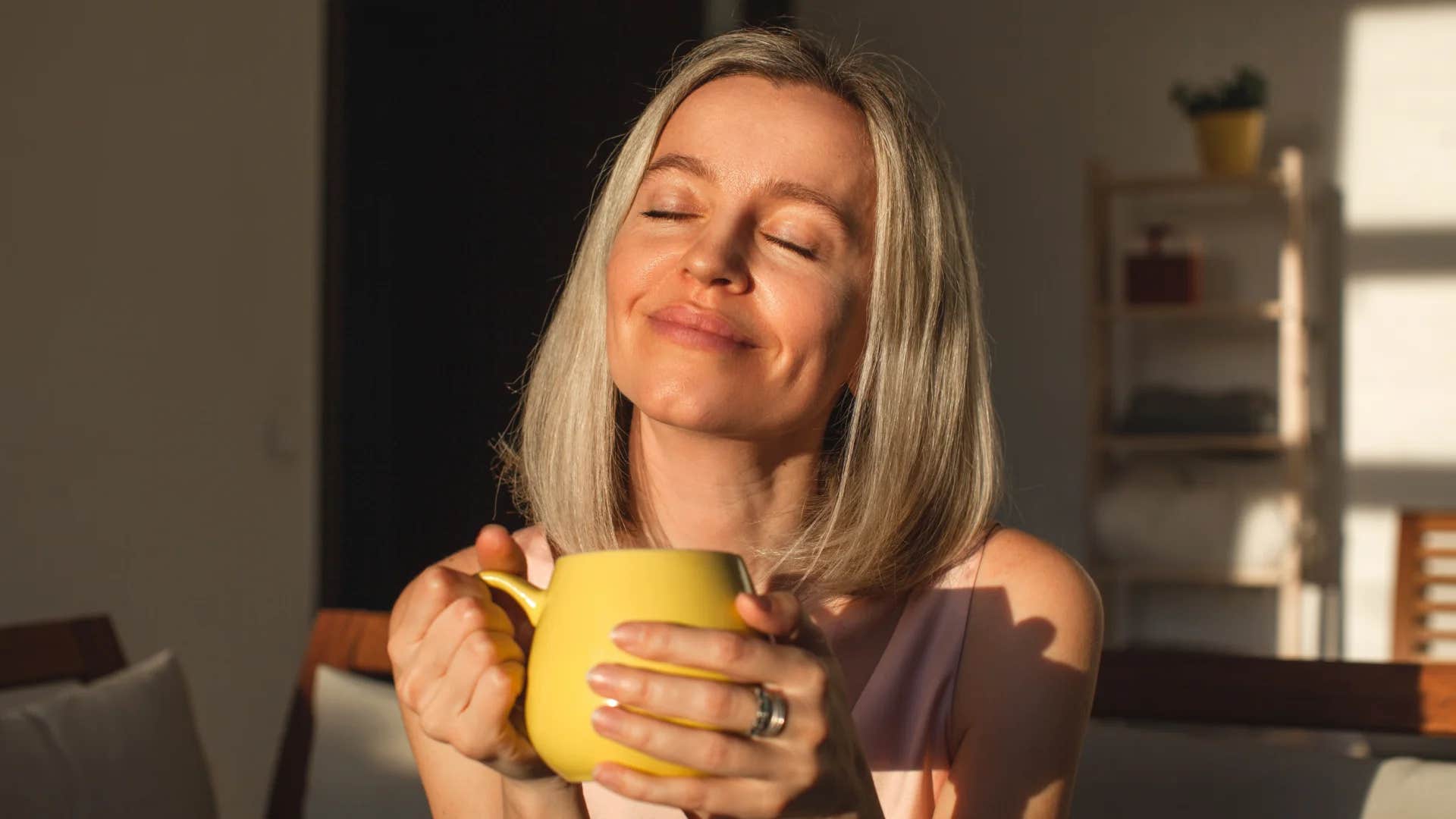 high iq woman smiling and finding meaning in the mundane at home