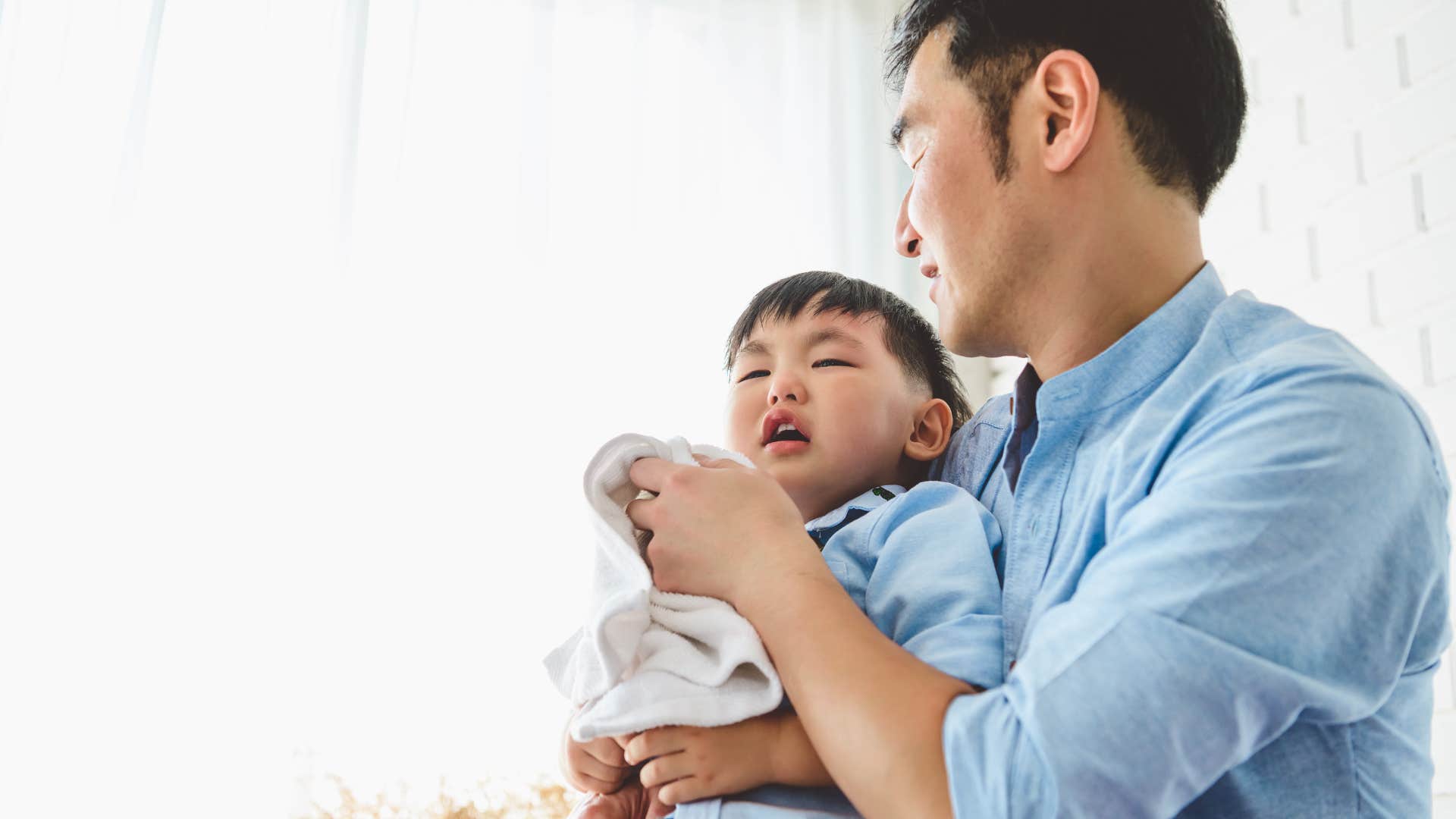 dad comforting upset son not trying to fix his problems