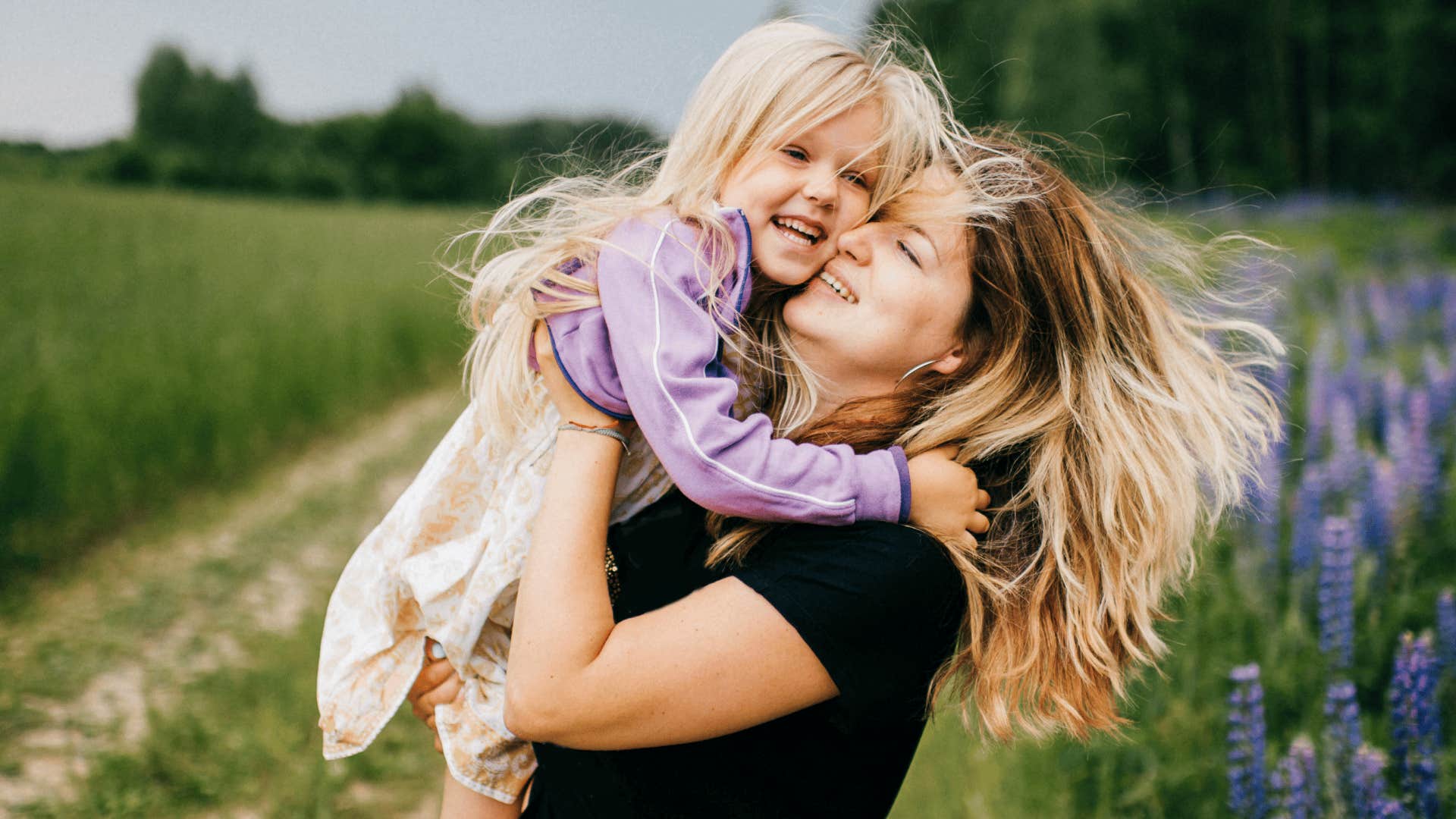 mother leading with kindness playing with her daughter