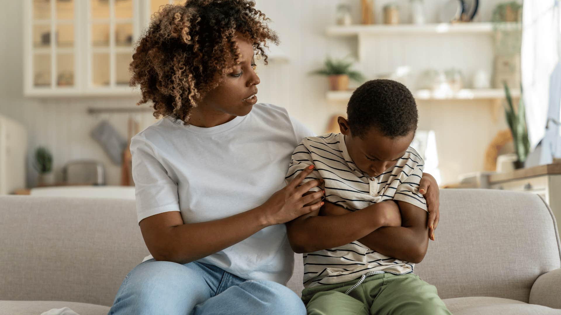 caring mother offering her young son support