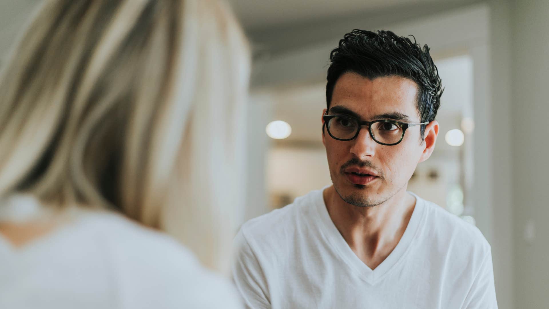 man with tremendous inner strength thinking before speaking in a conversation