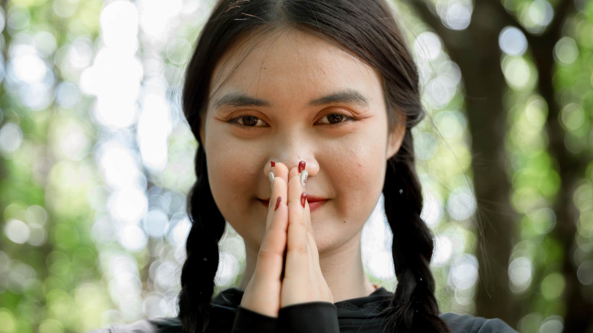 woman with tremendous inner strength using mantras smiling