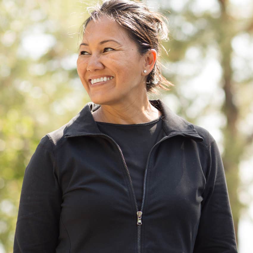Woman focused on her routine walking outside and smiling