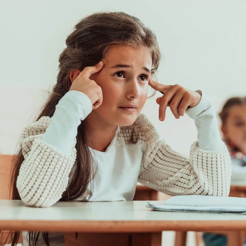 little girl struggling with understanding at school from using AI too much