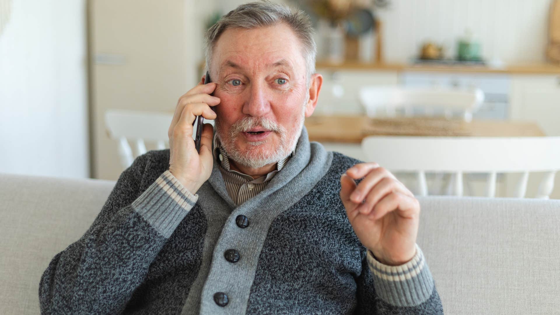 retired older man talking on phone trying to maintain a friendship